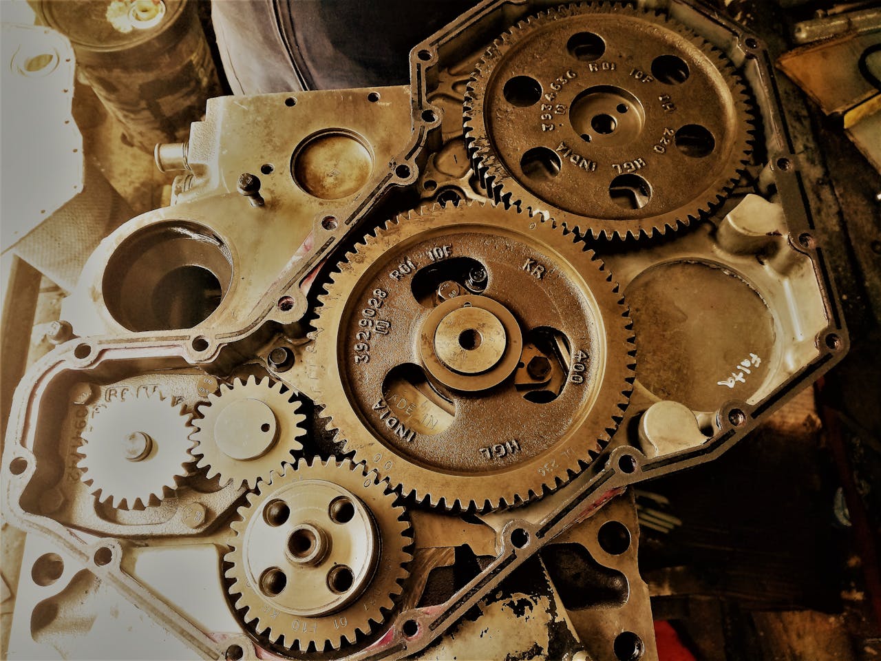 Detailed view of interconnected gears showcasing engineering precision and technology in a workshop.